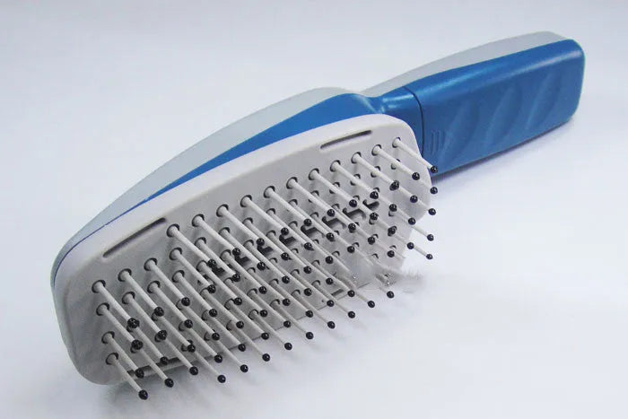 Pet comb with negative ion technology showing removable brush head and 78 comb teeth for grooming with active oxygen release