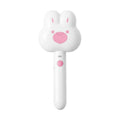 Rechargeable pink cartoon-design steam brush comb for grooming cats and dogs on a table.