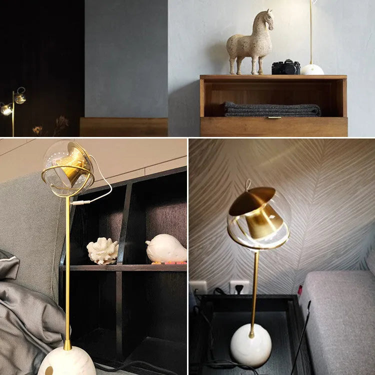 Clear glass desk lamp with touch dimmer and LED light on a wooden table