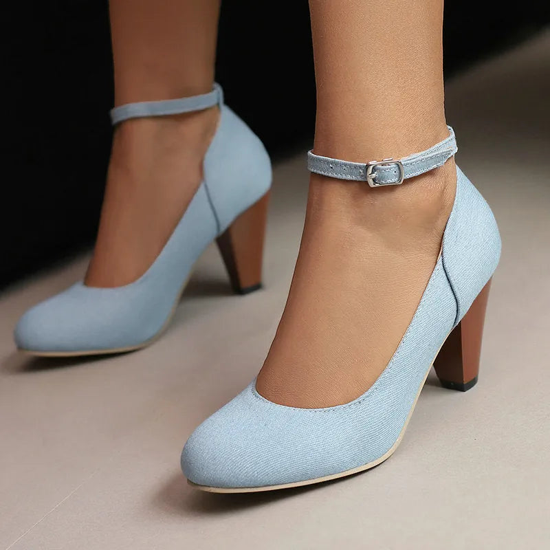 Blue denim women's high heel ankle boots with a silver buckle and waterproof platform sole.