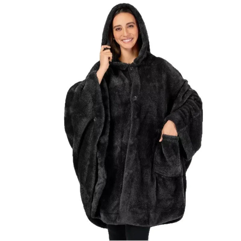 A thick pink hooded cloak bathrobe with long sleeves, shown on a hanger.