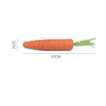Carrot-shaped paper toys, plastic ringing stones, and textured cat sticks for interactive pet play