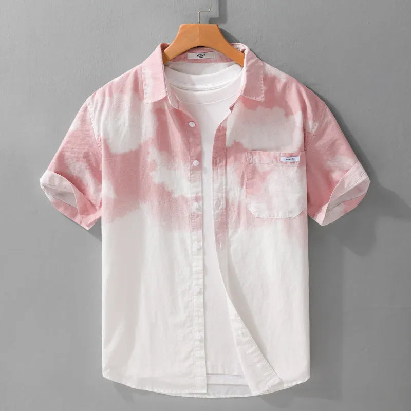 Man wearing a light pink loose-fit short-sleeved cotton cardigan style shirt.
