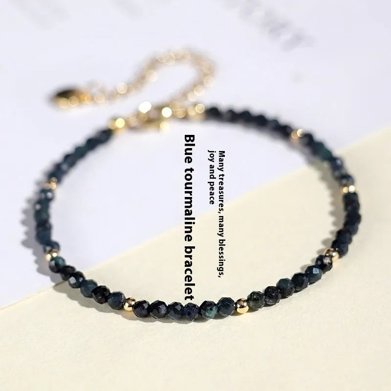 3mm blue tourmaline spacer bead bracelet showing alternating gemstone beads and metal elements