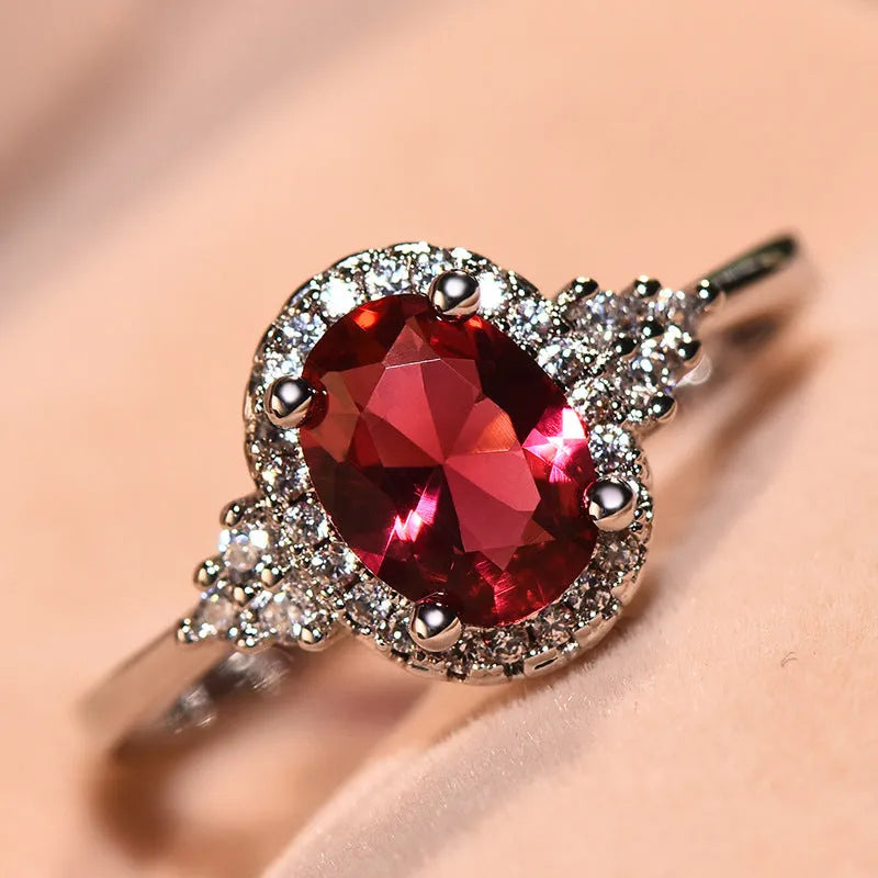 Adjustable oval ruby ring with copper open-mouth band, white gold colour finish, sizes 6 to 10