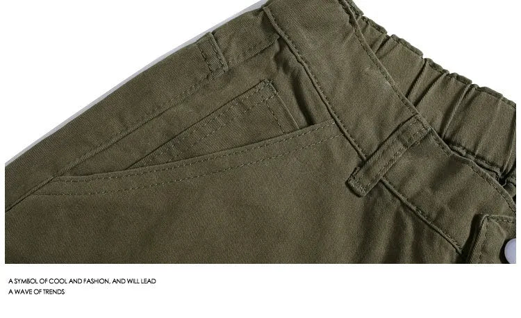 Women's loose fit cropped workwear pants with wide-leg design and rivet detailing