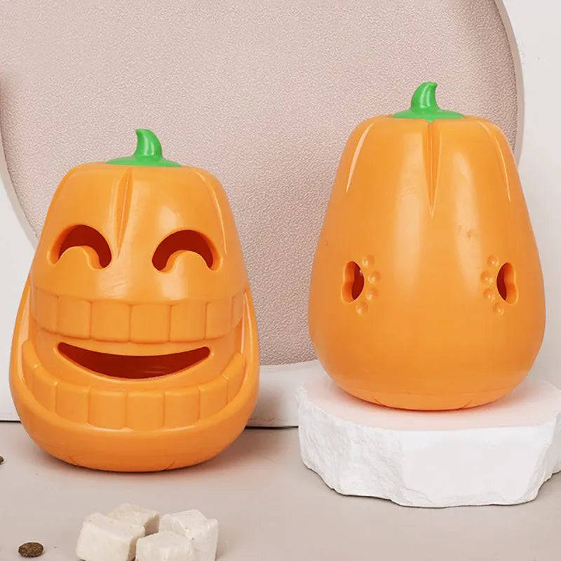 Orange Halloween pumpkin shaped dog chew toy with a treat-dispensing funnel opening.