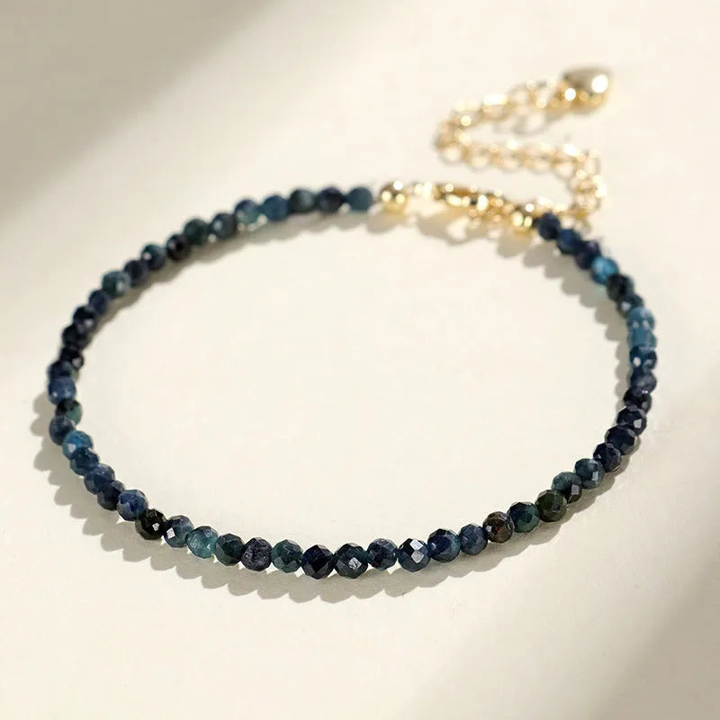 3mm blue tourmaline spacer bead bracelet showing alternating gemstone beads and metal elements