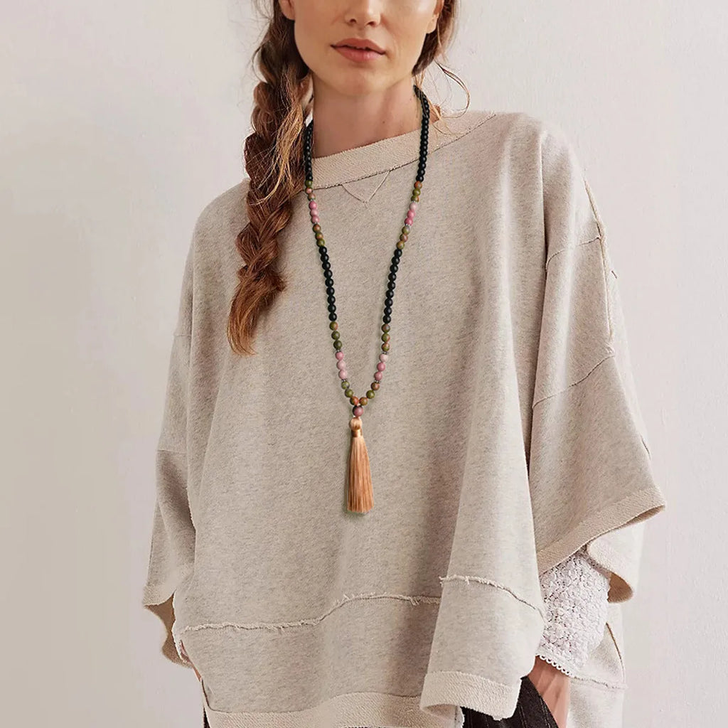 Handmade long beaded necklace with gemstone pendant and tassel, showing 81cm+ length.