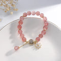 Strawberry quartz crystal bracelet with electroplated flower pendant in Mori style design