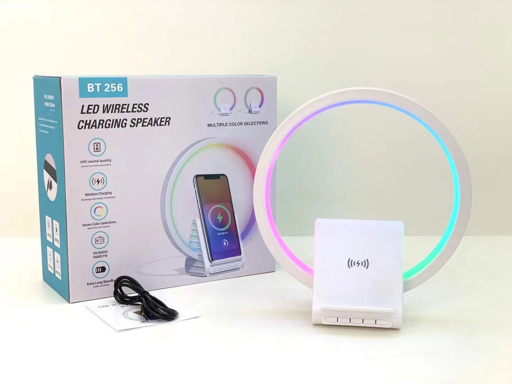 White rectangular smart Bluetooth speaker with integrated wireless charging pad and ambient lighting