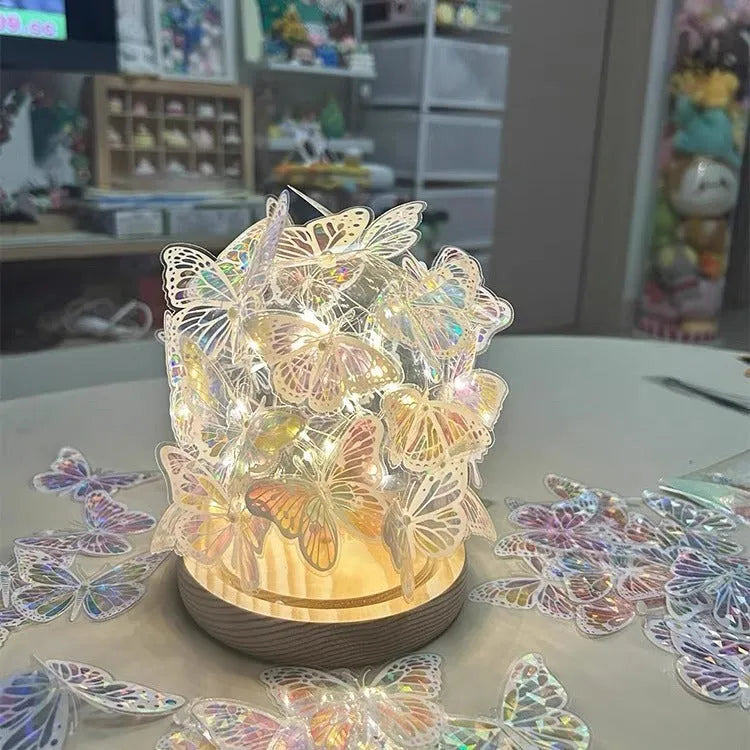 Handmade butterfly night lamp with glass shade and wood base on bedside table