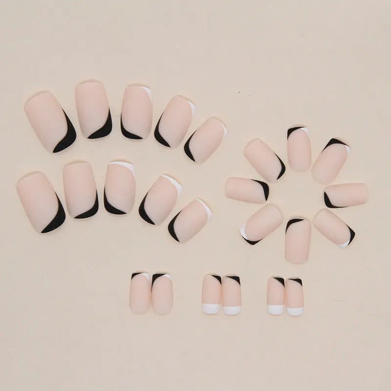 Black and white frosted artificial nails with mandarin duck colour design for French manicure