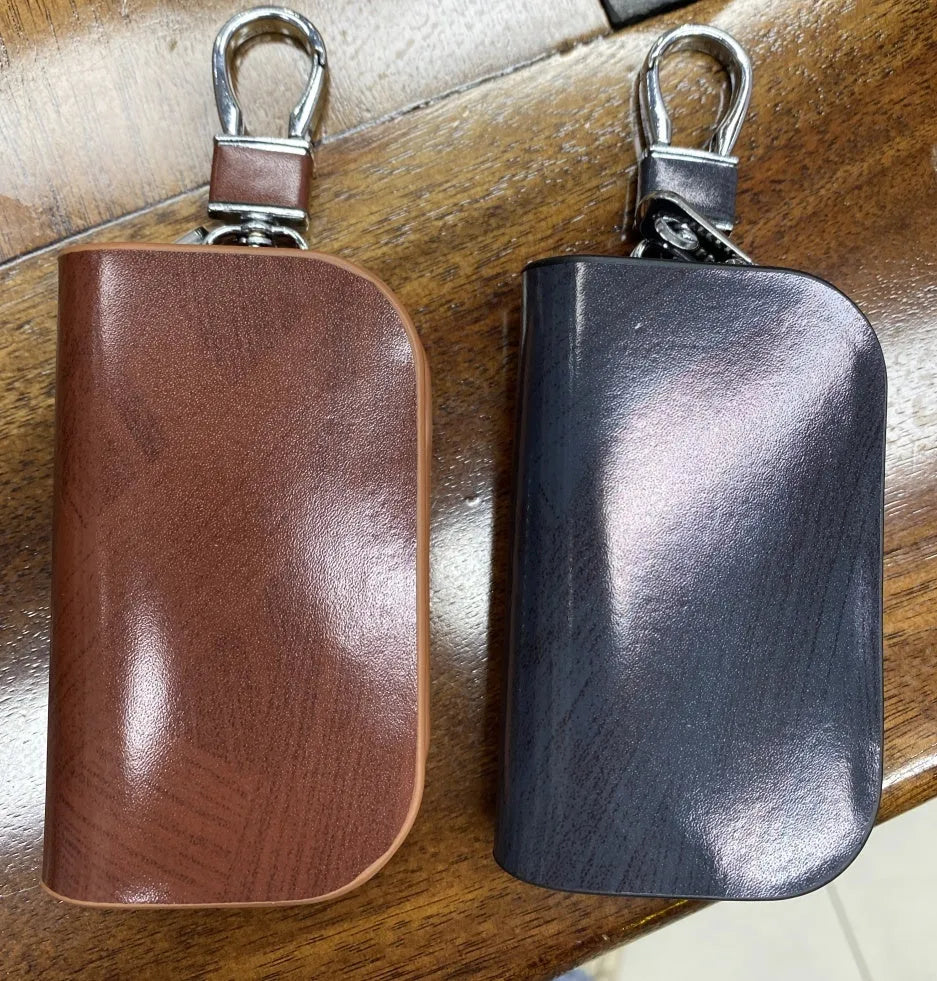 Genuine leather car key case with frost finish and zipper closure in black or brown