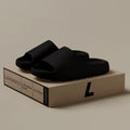 Women's thick-soled EVA beach slippers in beige, black, brown, or green on a plain background.