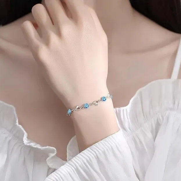 Blue diamond coloured beating heart necklace and bracelet set with gem inlaid pendant on electroplated copper.