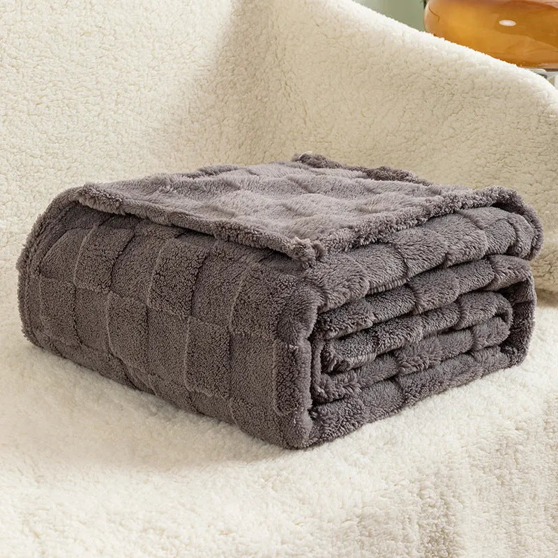 Geometric pattern polyester fleece blanket in creamy white colour showing thickened texture