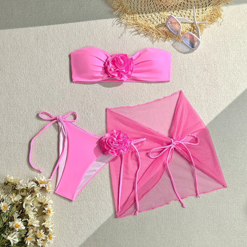 Women's tube top swimsuit with big flower tie, matching pants and skirt in blue