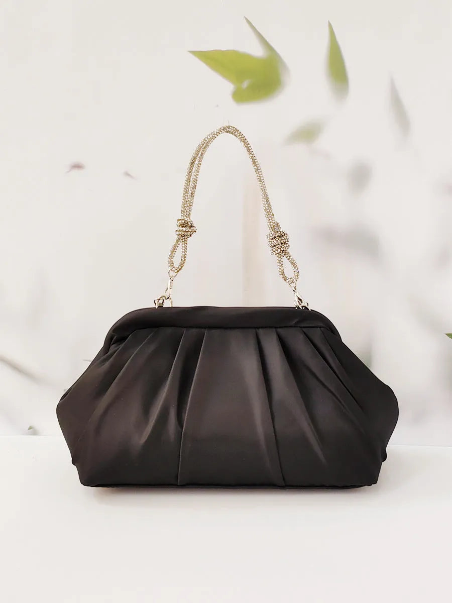 Women's soft polyester messenger bag with diamond folds and chain detailing in black colour