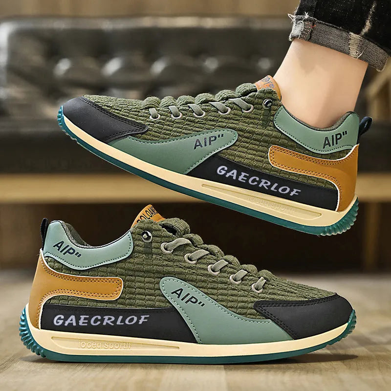 Men's grey and green mesh running shoes with round toe and lace-up closure shown in sizes 39-44