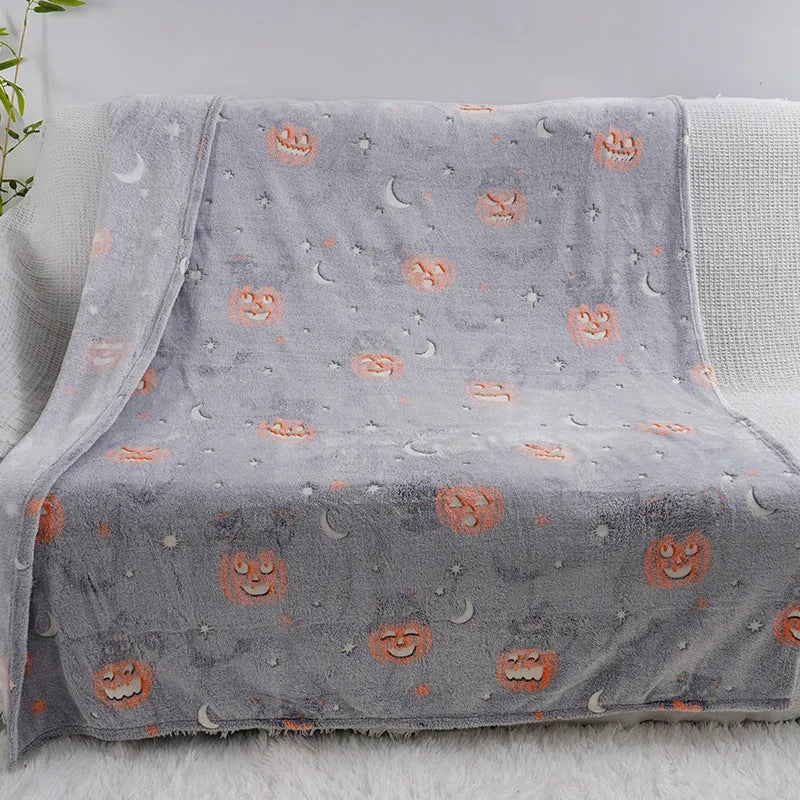 Cartoon print flannel blanket shown in two sizes, suitable for a child or as an air conditioner cover.