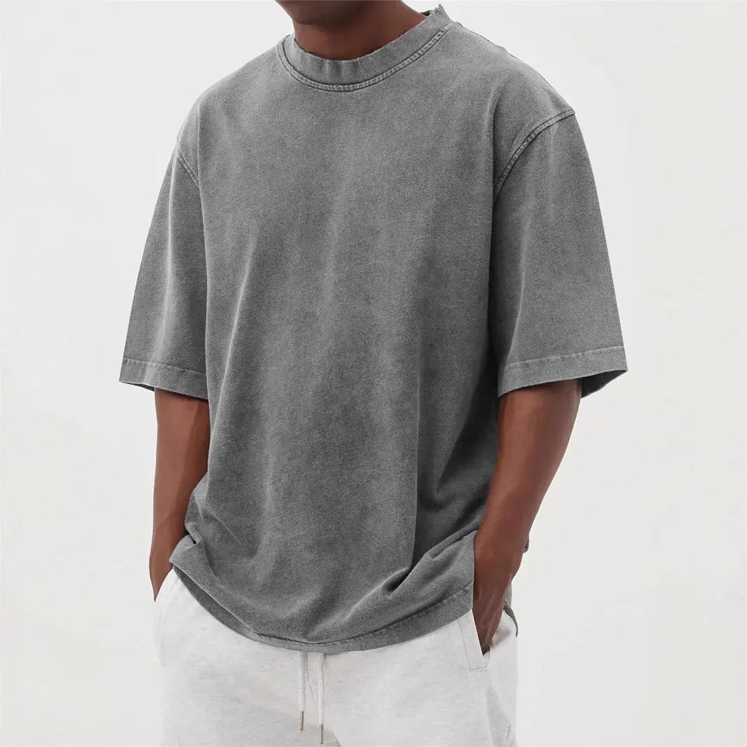 Men's stonewash distressed polyester pullover T-shirt in solid colour with loose fit and half sleeves