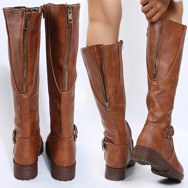 Women's black knight boots with square heel, round toe, and high shaft featuring belt buckle detail
