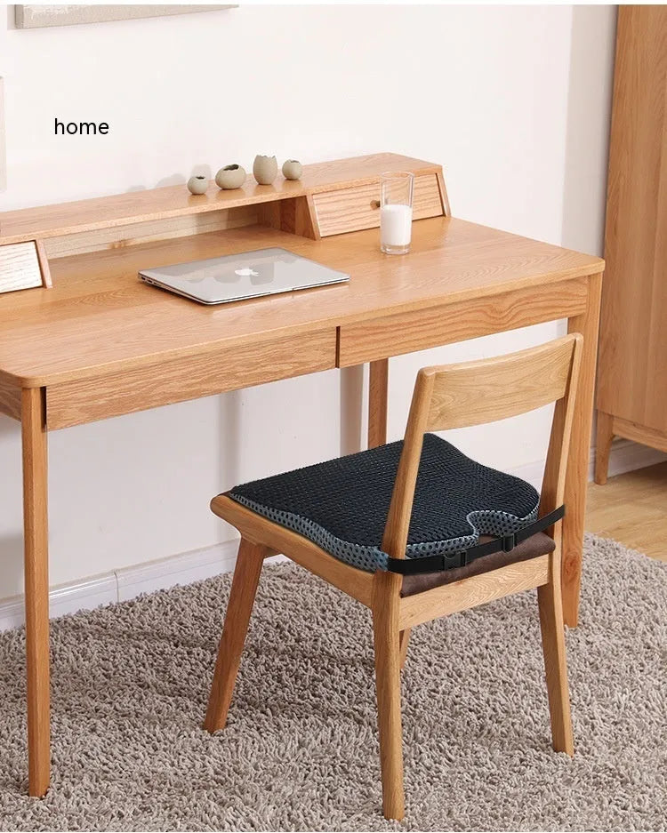 Memory foam seat cushion with elastic strap in black, grey, and creamy white colours.