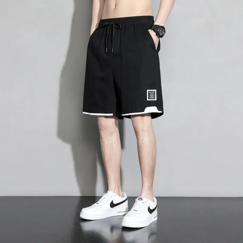Boys cotton shorts in black, khaki and white colours showing mid waist design and shorts length