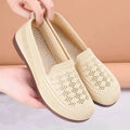 Beige low-top mesh casual trainers for women with a round toe and flat PVC sole.