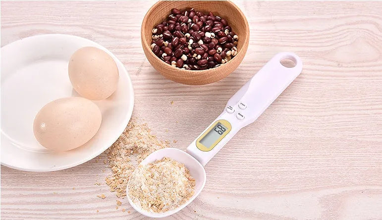 Electronic measuring spoon scale with digital display showing weight measurement