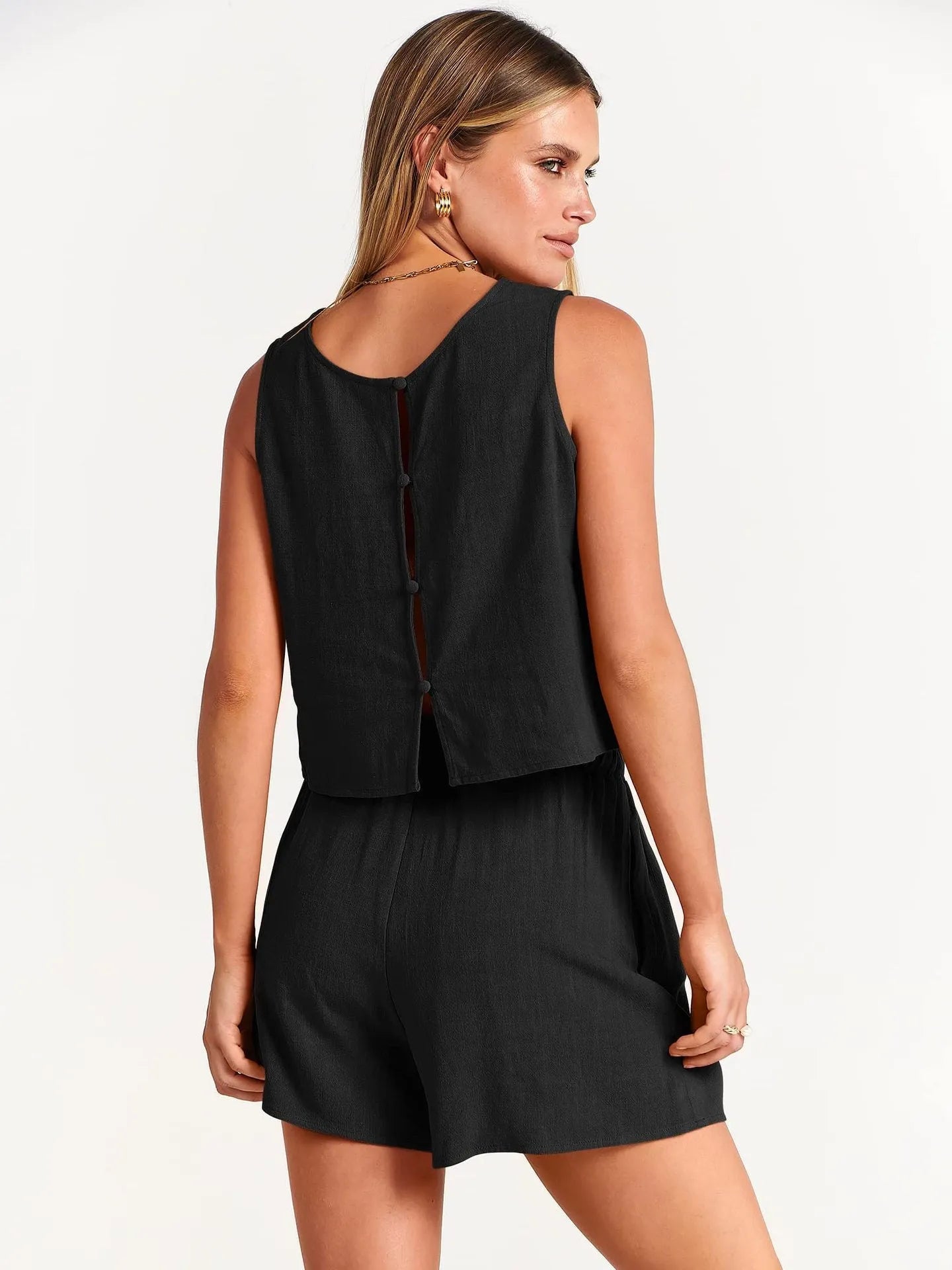 Women's apricot coloured sleeveless top and drawstring shorts summer set laid flat.