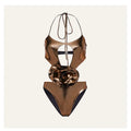 Gold coloured handmade halter neck one-piece swimsuit with hollow-out design on a mannequin.