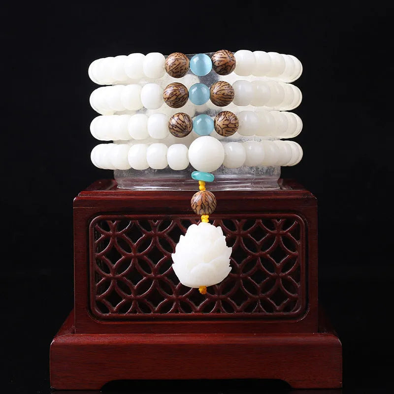 White jade Bodhi bead bracelet with 6x8mm beads in various decorative styles