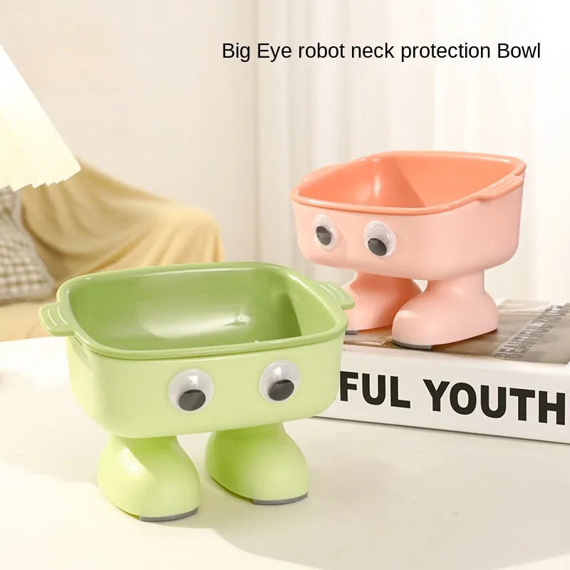 Green cartoon robot shaped elevated cat bowl with tilted food dish on anti-slip base