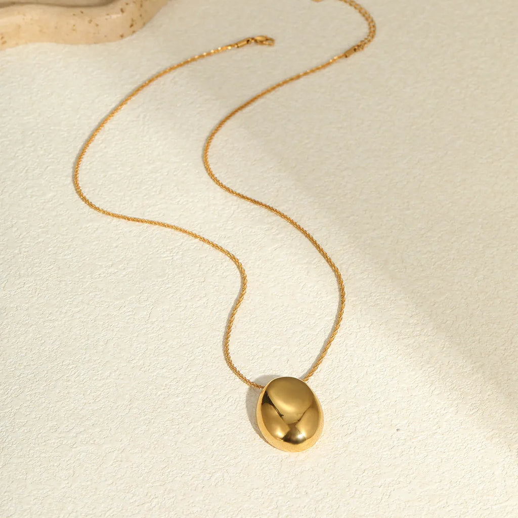 Gold geometric pendant necklace on adjustable 41-50cm chain, stainless steel with electroplated finish