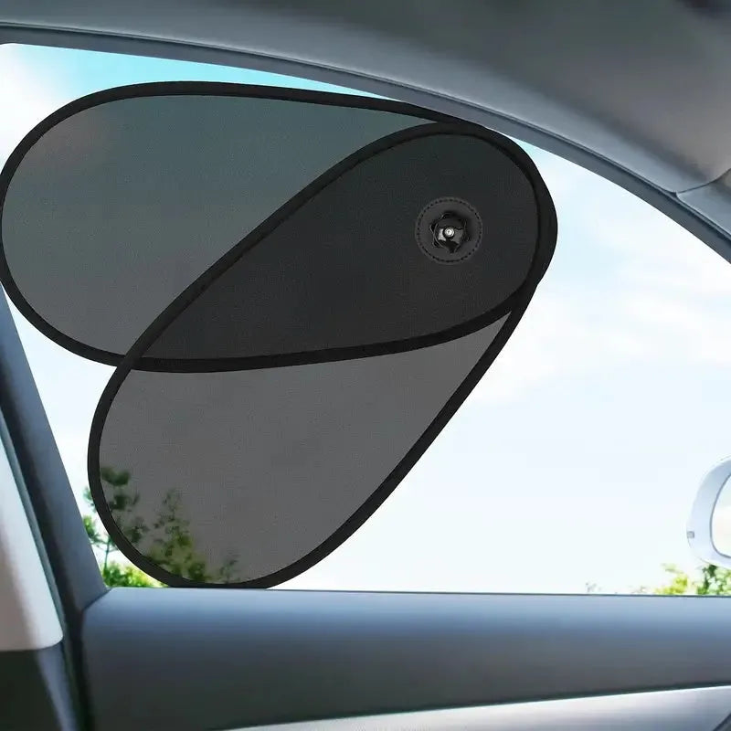 Black stretchy car window shade with suction cups attached to a side window.