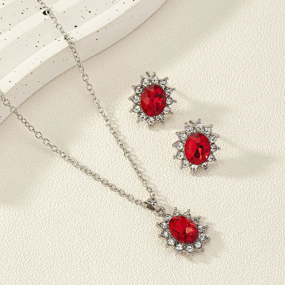 Alloy necklace and earring set with elliptical zircon elements in electroplated colours