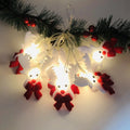 Snowman LED Christmas string lights garland with warm white LEDs on green wire