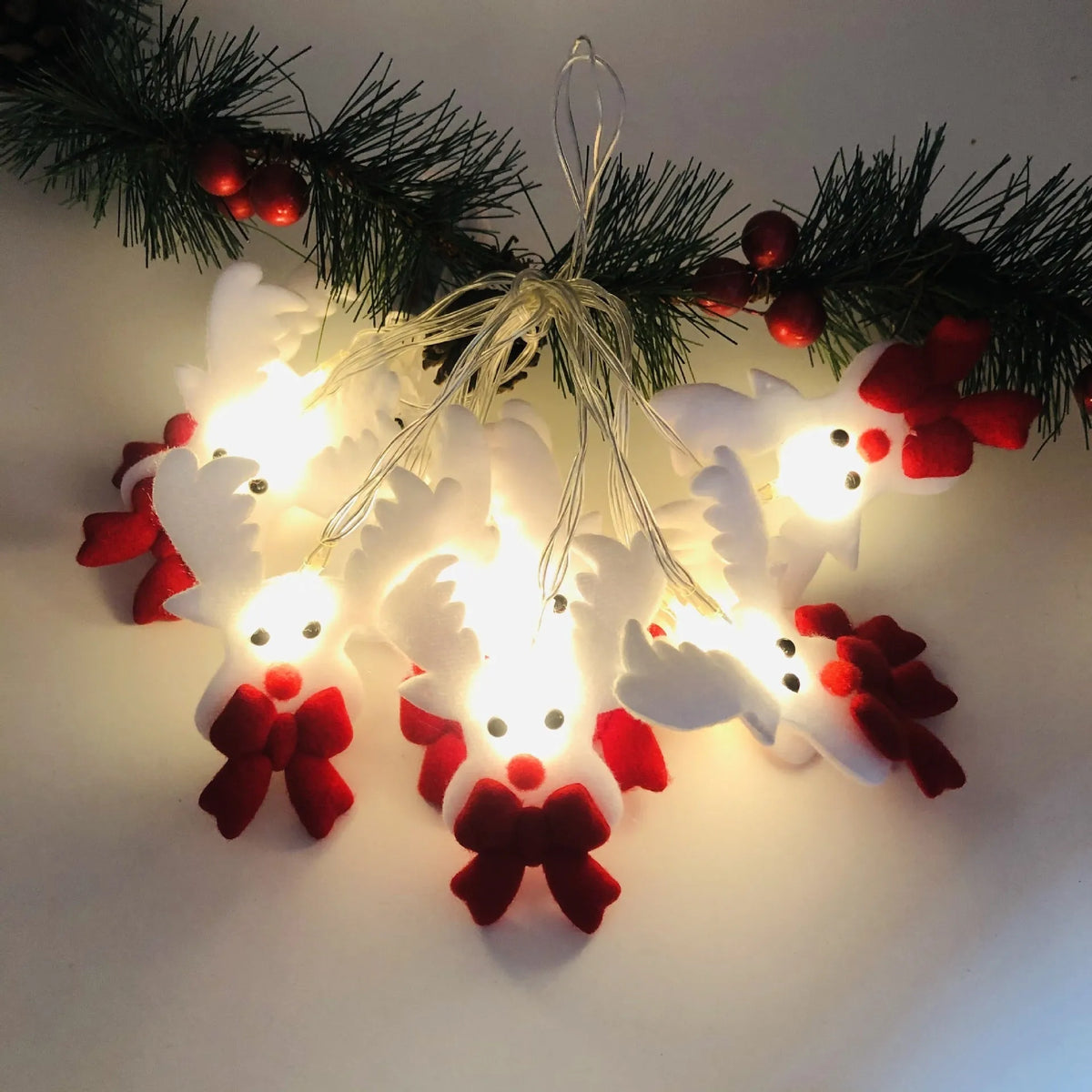 Snowman LED Christmas string lights garland with warm white LEDs on green wire