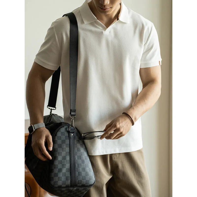 Blue short-sleeved casual polo shirt on a hanger showing the collar and button placket.