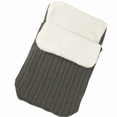 Envelope-style baby stroller sleeping bag in beige colour showing thick cotton wool filling and soft lining.