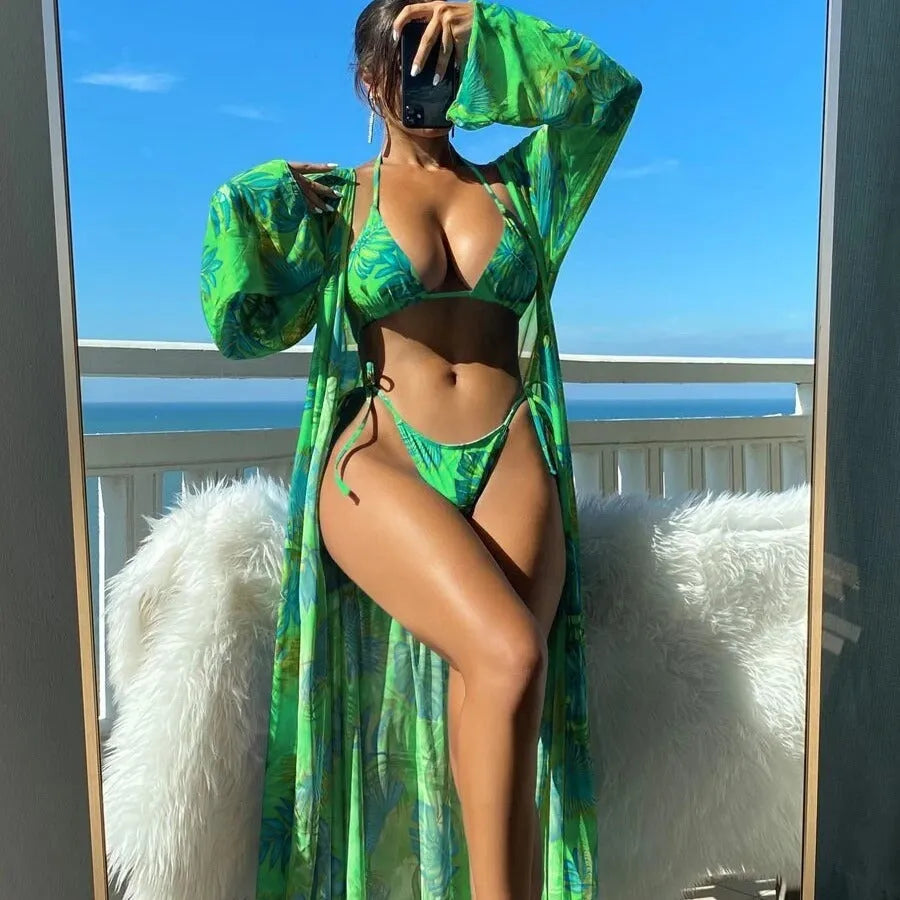 Blue two-piece bikini set with long sleeve blouse, banded briefs, and a robe.