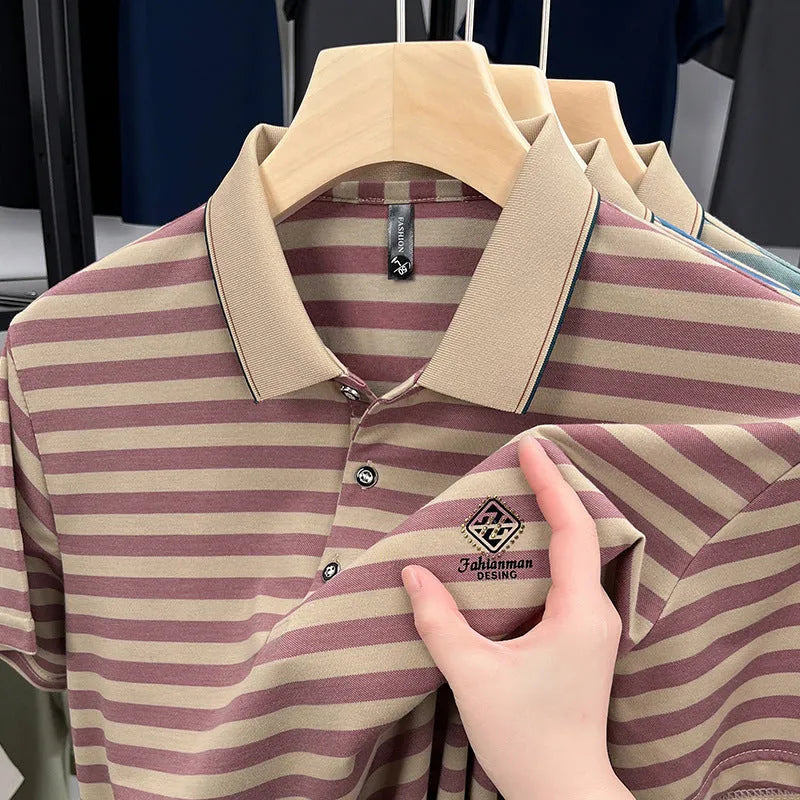 A man wearing a blue striped short sleeve casual top with a mosaic pattern design.