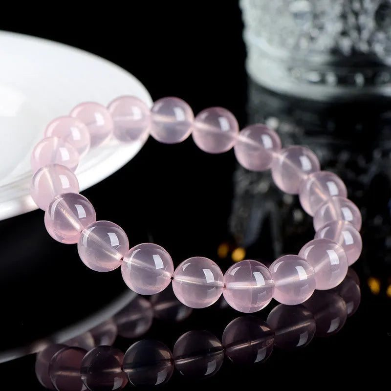 Women's crystal bracelet with polished round beads in pink starlight crystal, available in multiple bead sizes