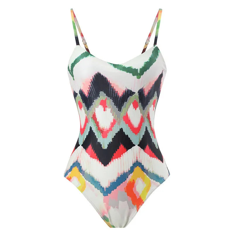 Women's two-piece striped swimsuit with a matching gradient print hip skirt laid flat.