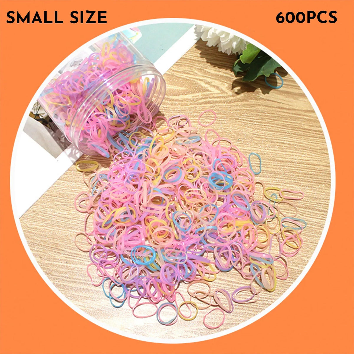 Pack of small, colourful TPU elastic hair bands for babies and toddlers in a reusable container.