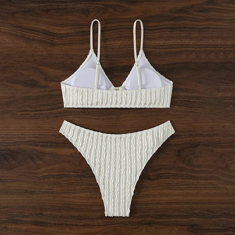 White women's V-neck sleeveless swimsuit top with matching split hem shorts.