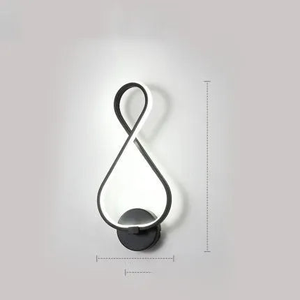LED wall lamp with silicone shade in black or white finish showing button switch control