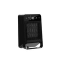 Black desktop electric warm air blower heater with digital touch screen display and remote control on a wooden desk.